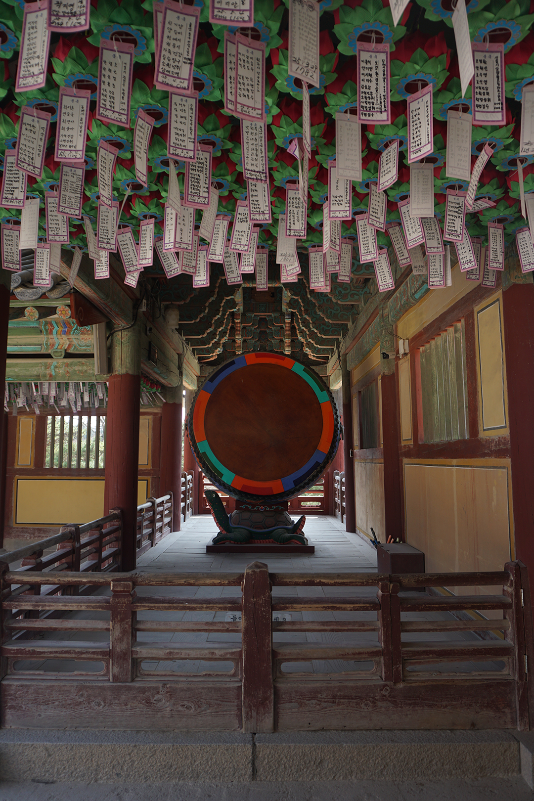 Korean drum with temple wishes hanging from ceiling