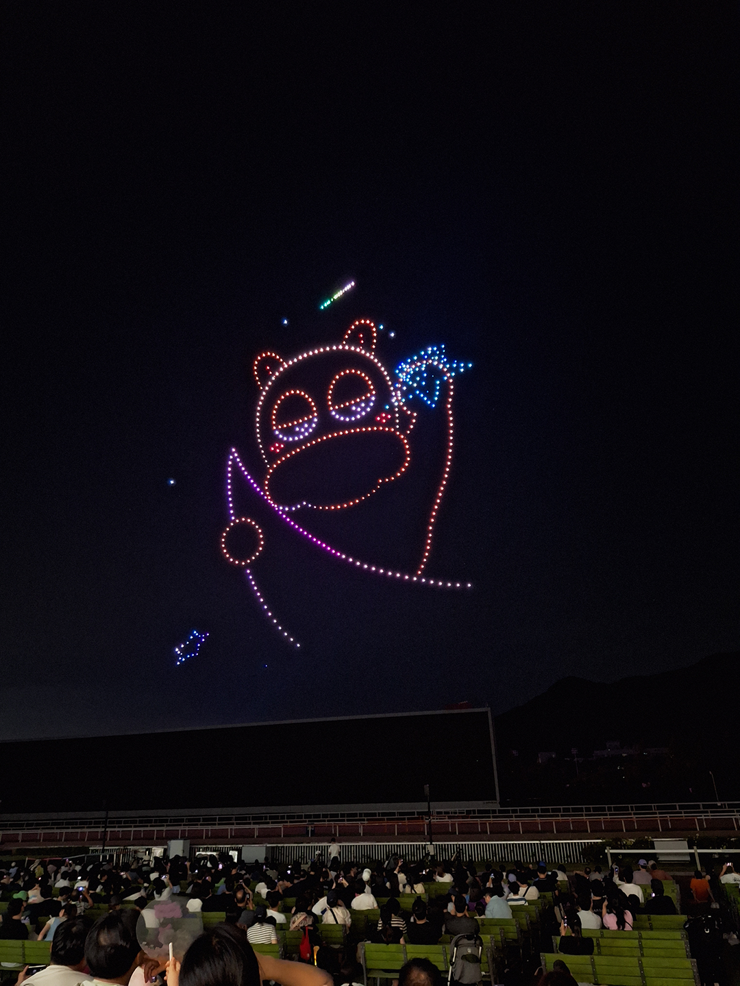 Malma created by drones, hugging the moon and waving